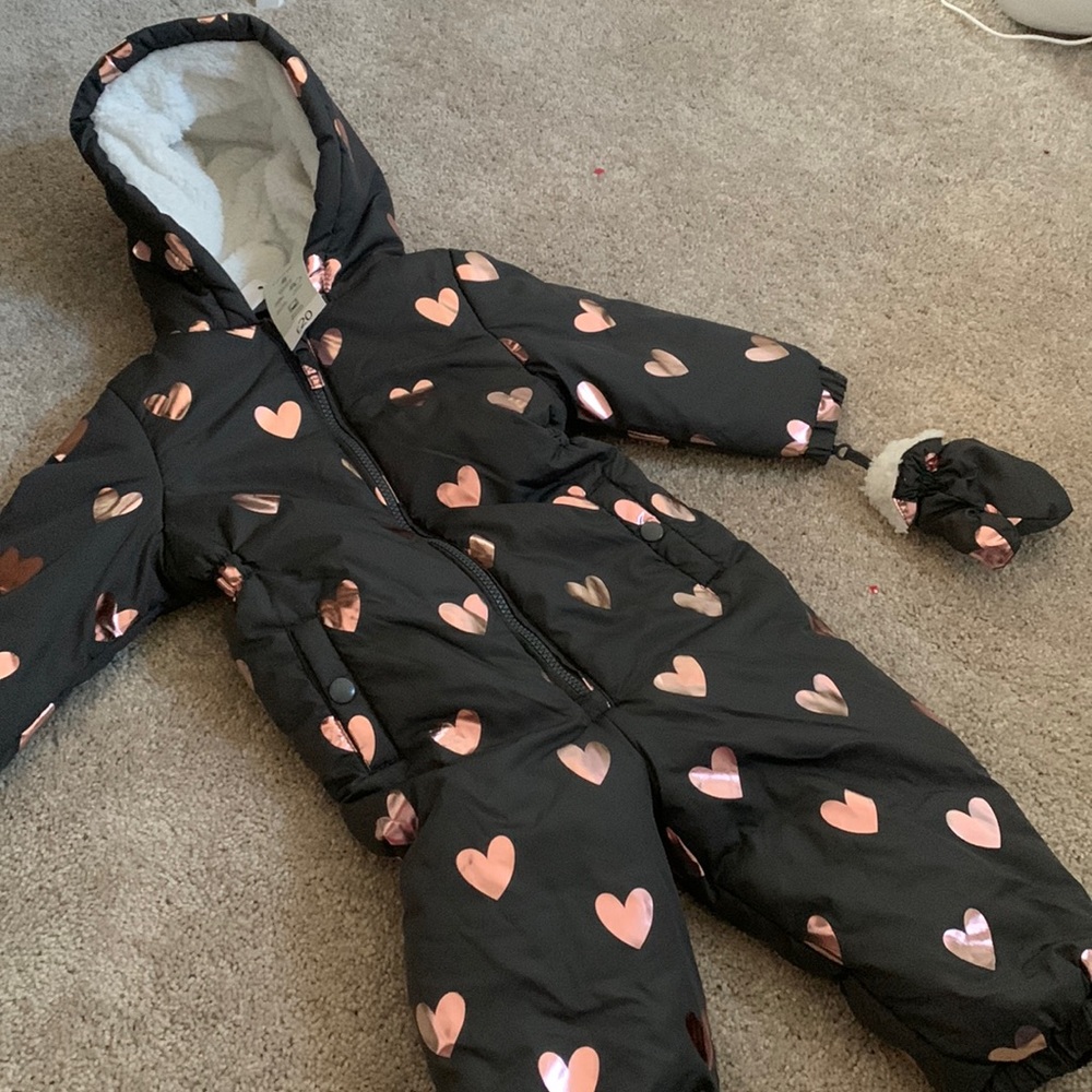 Kids snow suit with matching gloves attached.